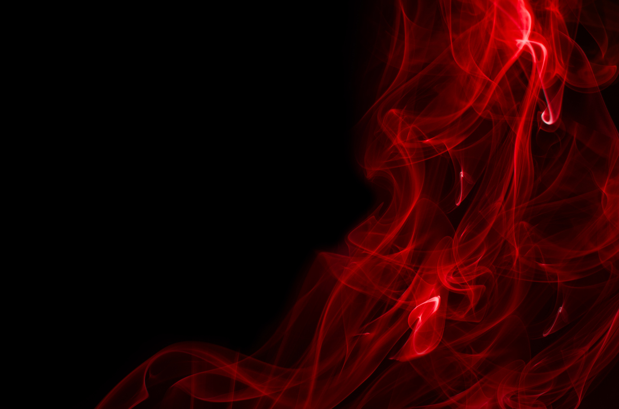 Red smoke on black background